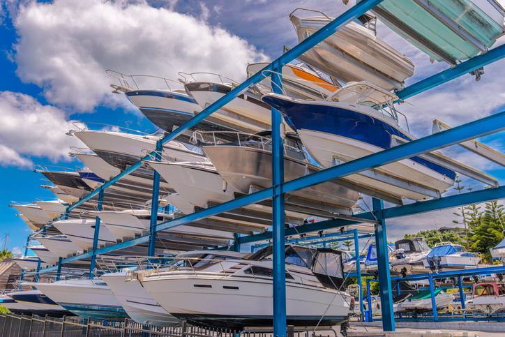 Boats, yachts stored up in dry storage waiting for maintenance